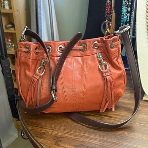 Stylish Orange Leather Shoulder Bag with Tassels